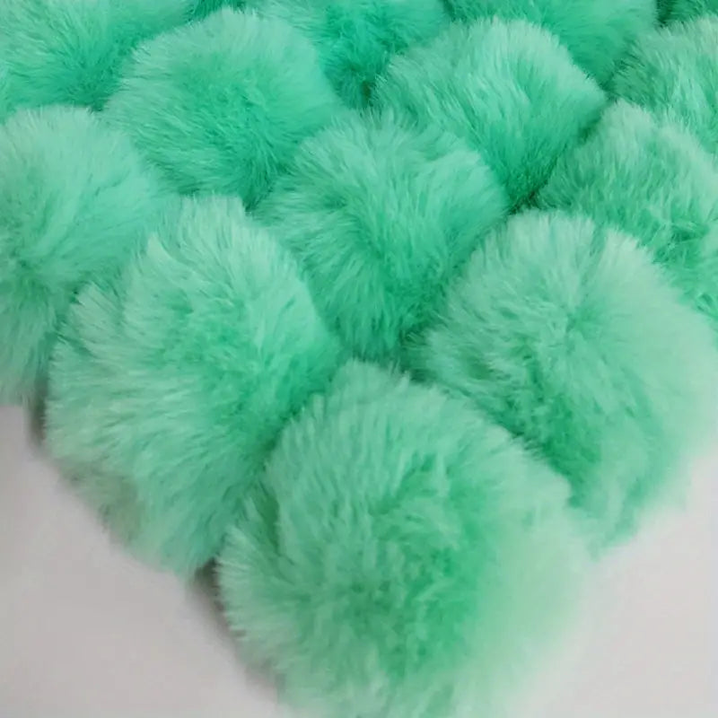Pompon de 8 cm avec élastique de fixation
